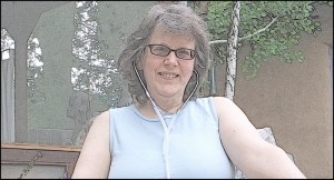 Lisa using a stethoscope for an ozone treatment.